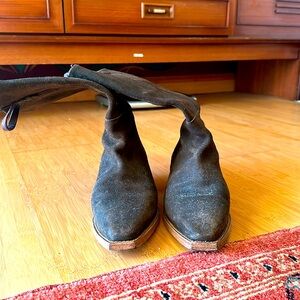 Free People tall surfed cowboy boots with gold studded heel detail.